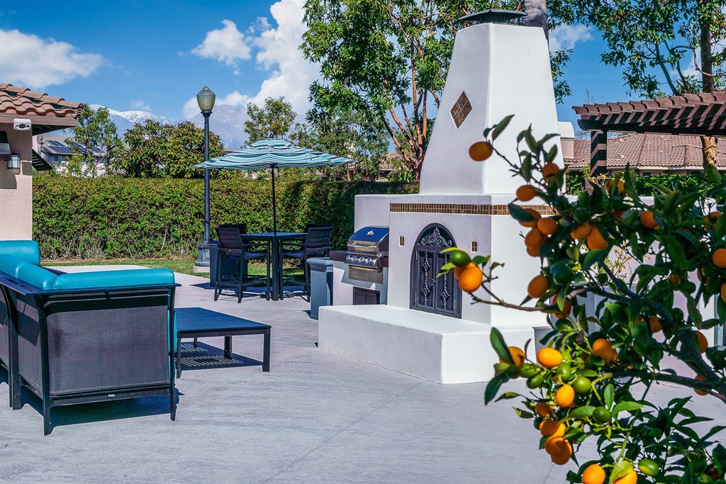 outdoor fireplace and lounge chairs