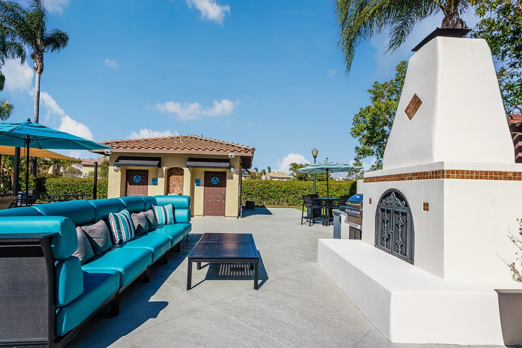 outdoor fireplace and lounge chairs