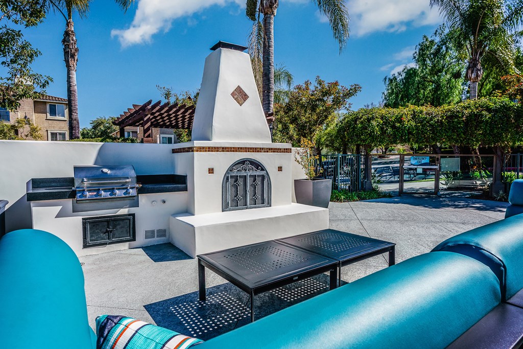 outdoor fireplace and lounge chairs