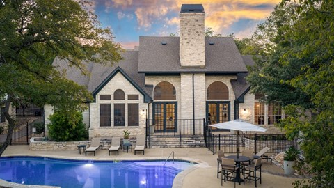 A house with a pool in the backyard.