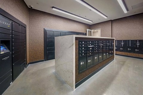the locker room is equipped with lockers and a marble counter at NoMa Apartments, California, 94596