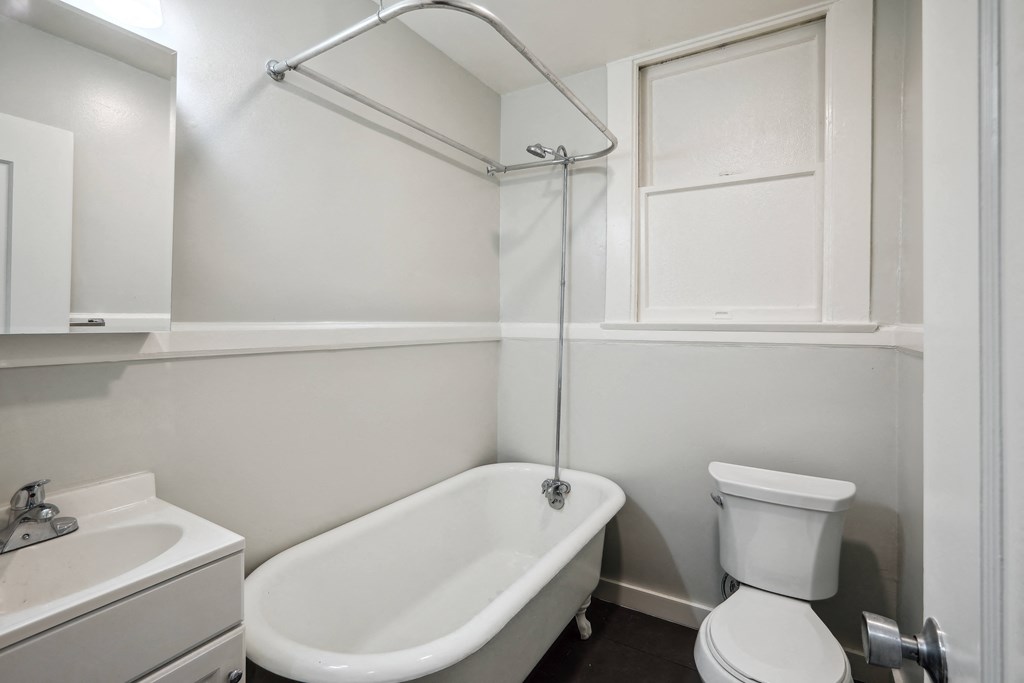 a bathroom with a toilet sink and bathtub