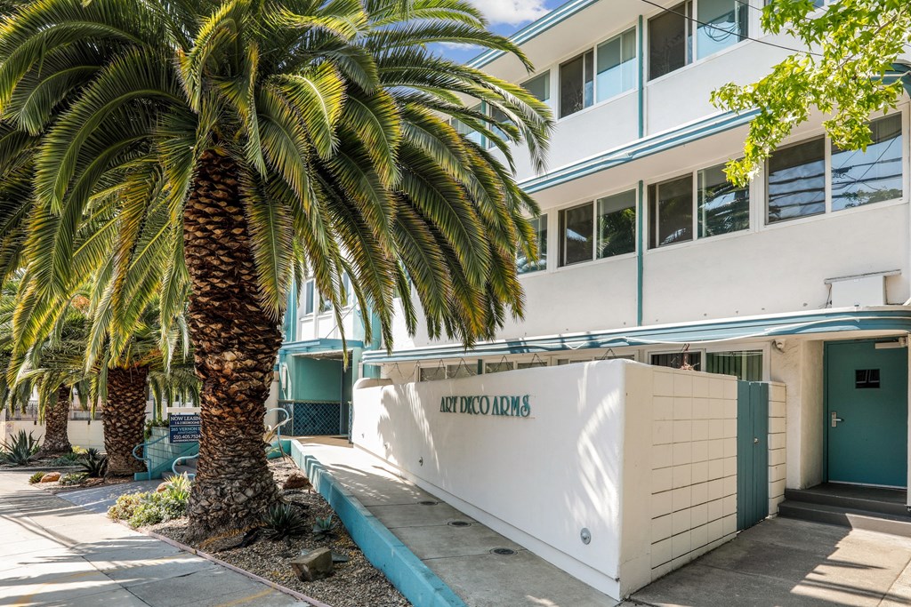 a building with a palm tree in front of it