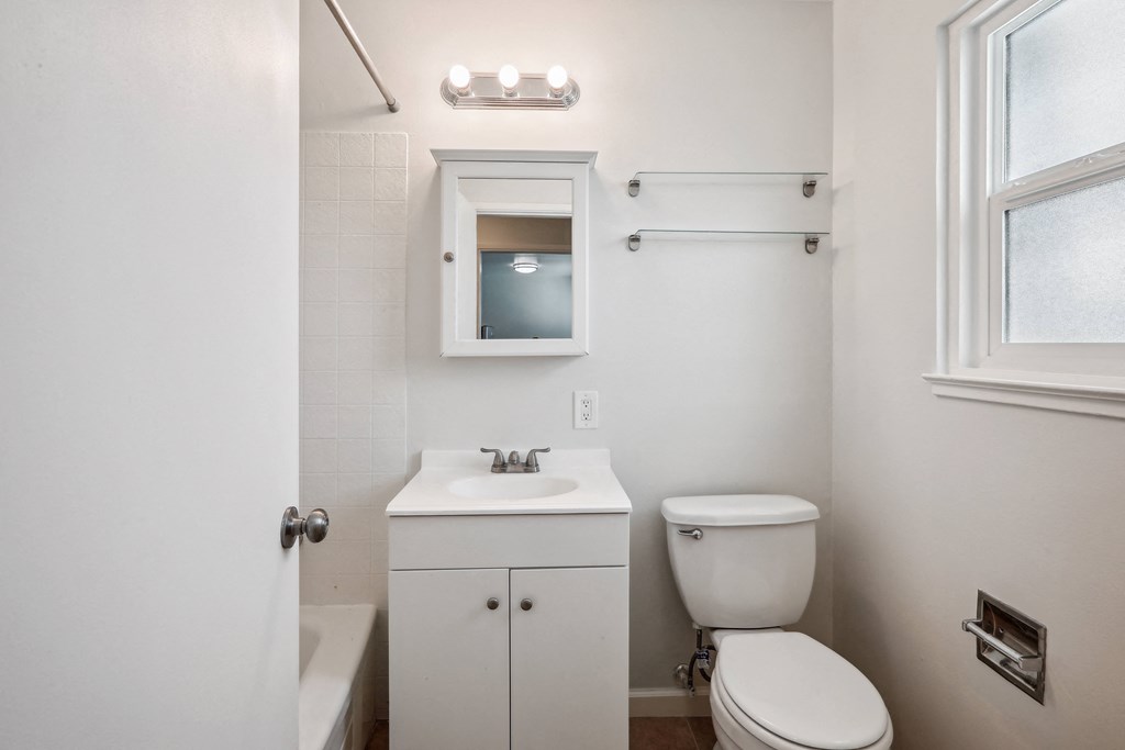 a bathroom with a sink toilet and bathtub