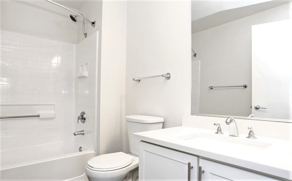 a bathroom with a toilet sink and bathtub
