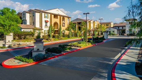an empty street in front of a row of houses