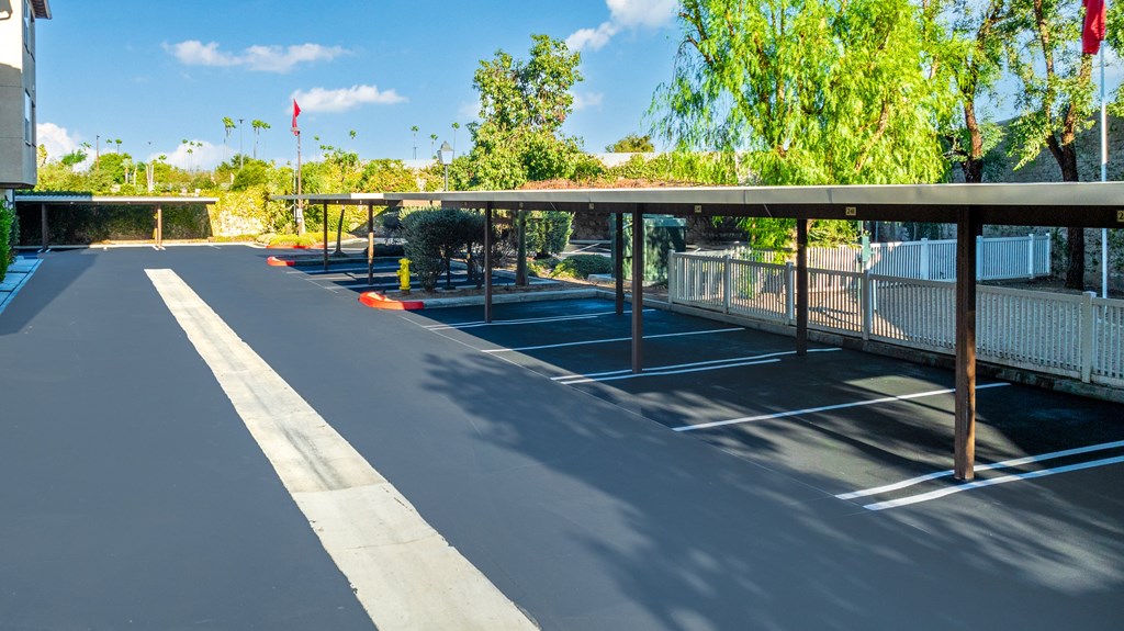 an empty parking lot with a covered parking lot