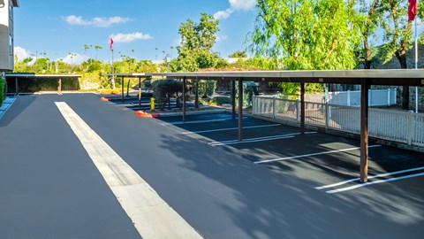 an empty parking lot with a covered parking lot