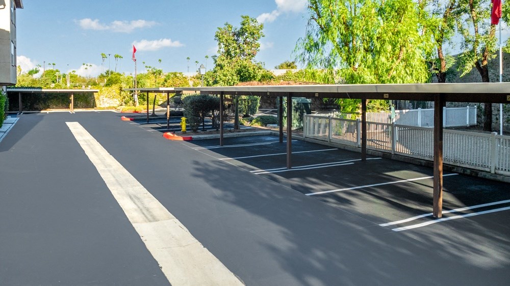 an empty parking lot with a covered parking lot