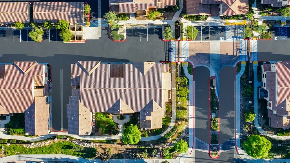 an aerial view of a neighborhood with houses and trees