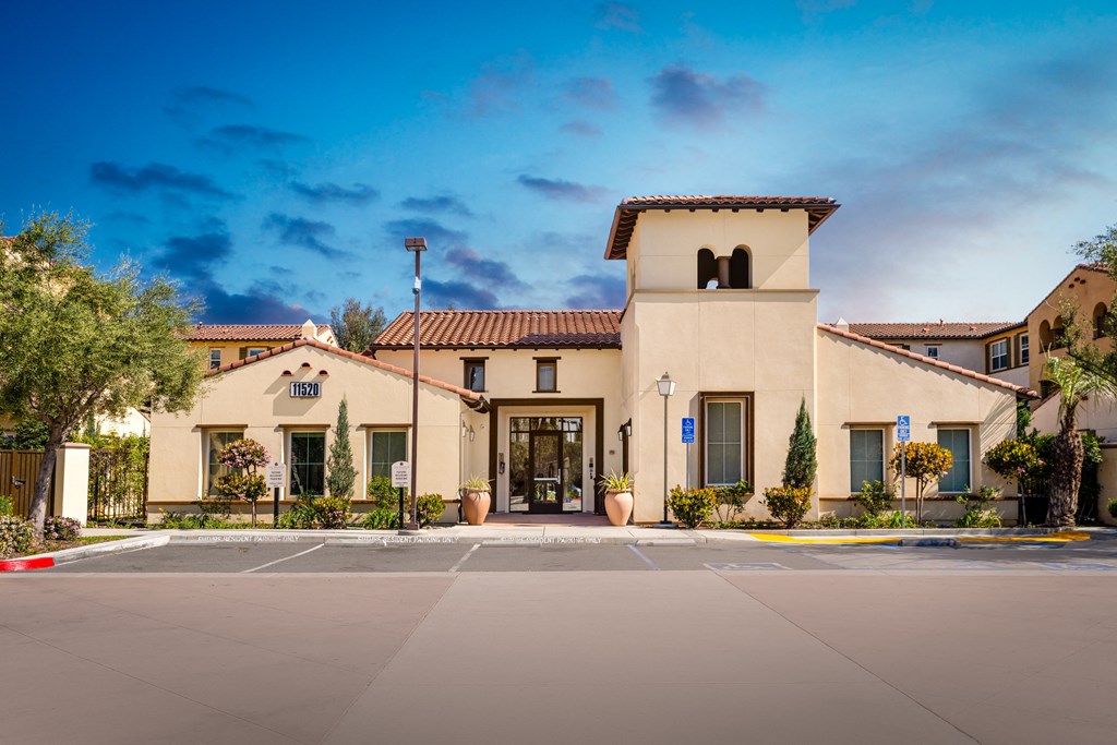 leasing office with potted flowers and trees