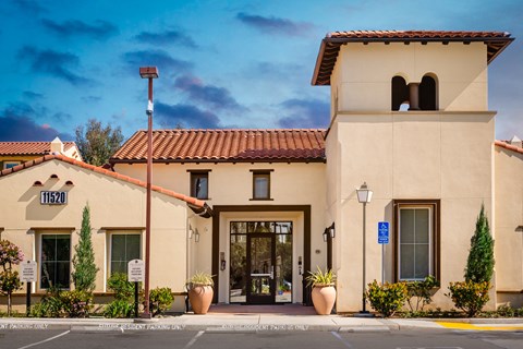 Leasing office with potted flowers and trees