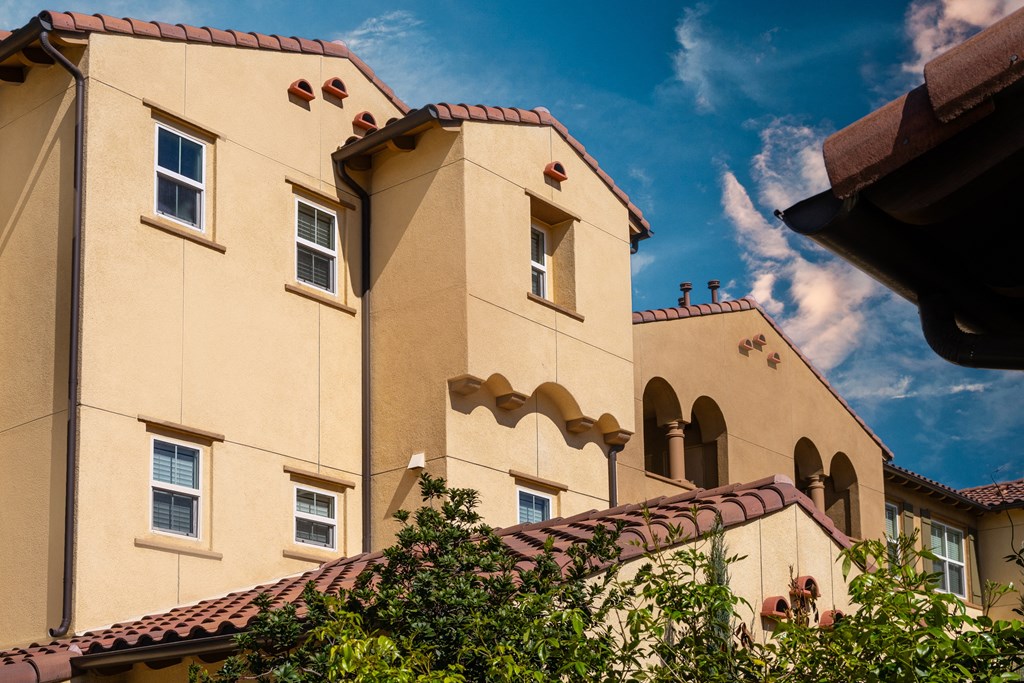a large building with a blue sky in the background