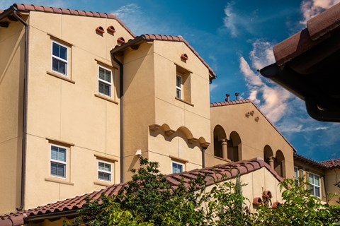 a large building with a blue sky in the background