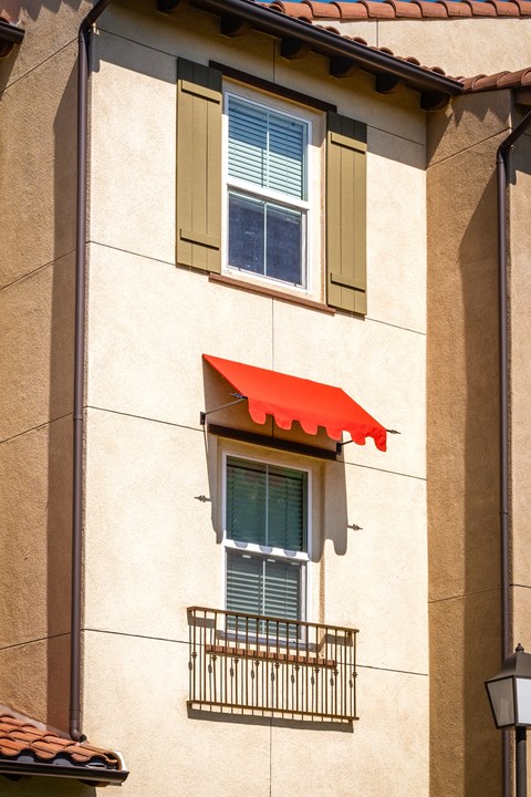 an awning on a window of a building