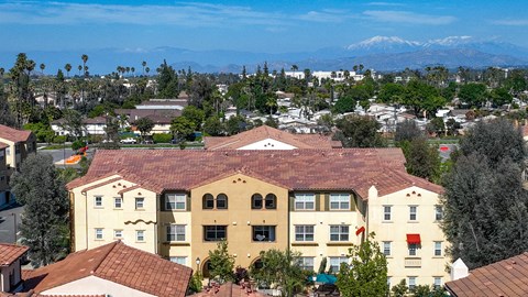 a view of the city and mountains from the top of a building