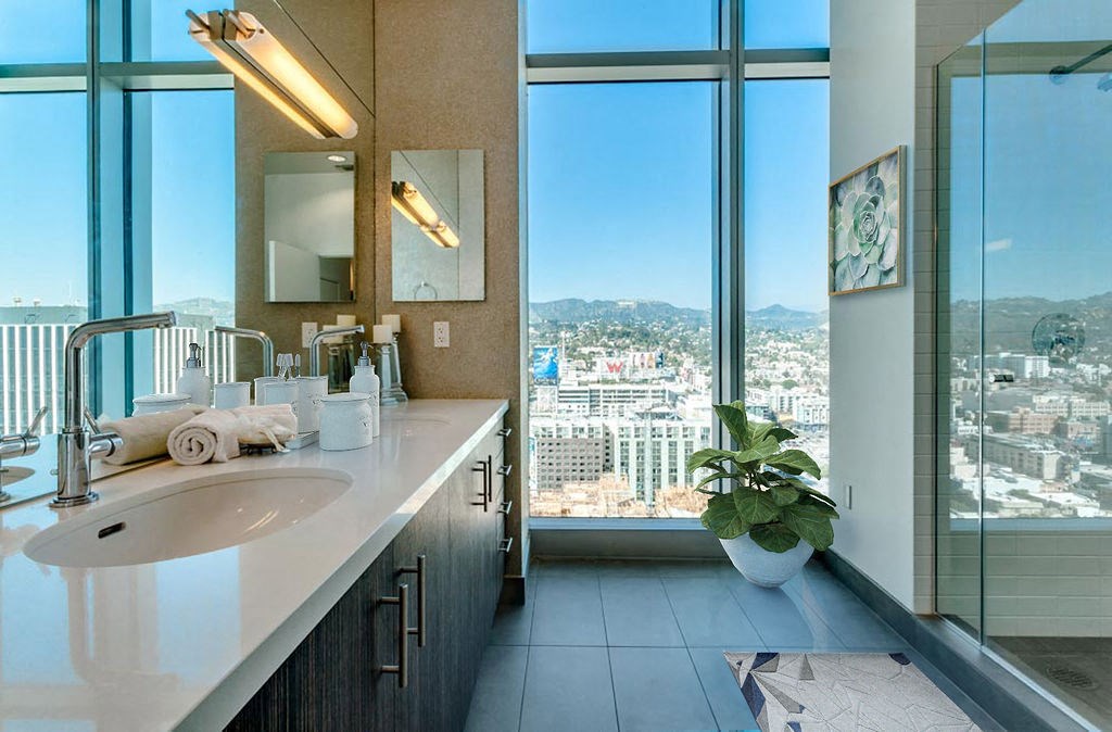 a bathroom with a large window and a sink