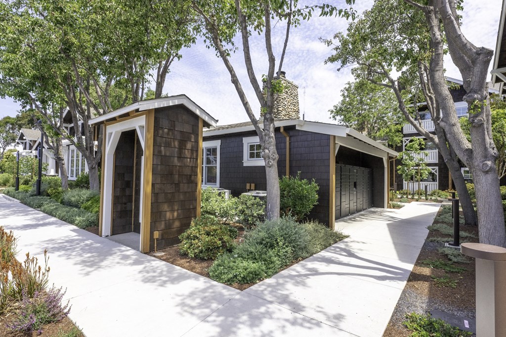 a house with a walkway and a garage