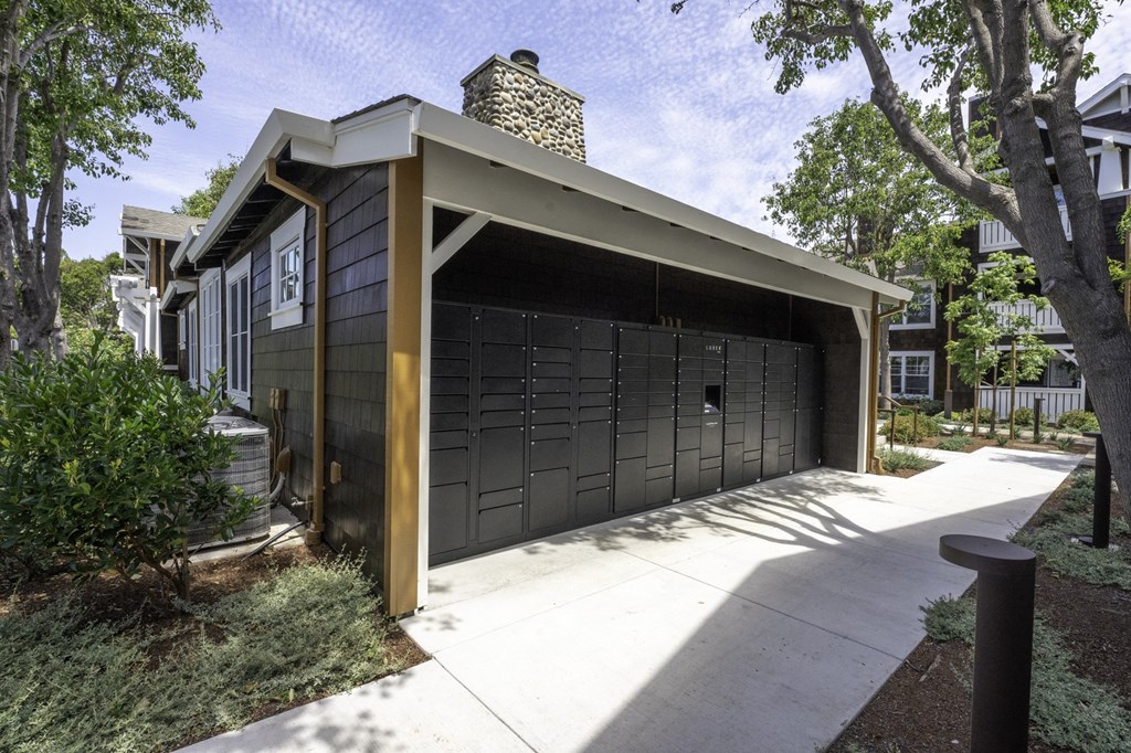 a garage with a garage door in front of a house