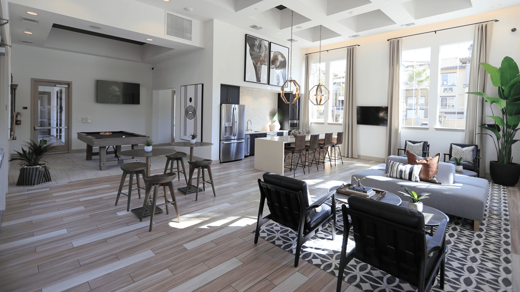 resident lounge with pool table and open kitchen