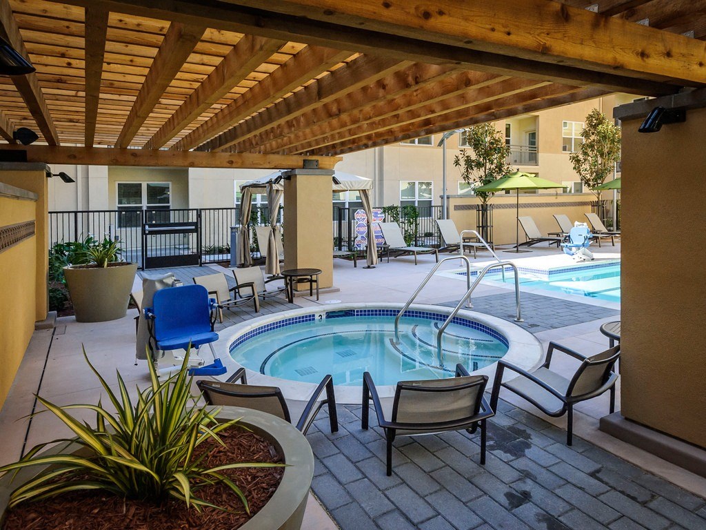 Apartments in Foster City - The Plaza - Outdoor Spa with Lounge Chairs and View of Pool Area