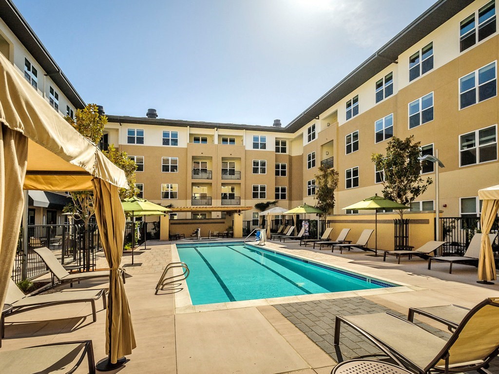 Apartments for Rent in Foster City, CA - The Plaza - Large Pool Area with Lounge Chairs and Cabanas