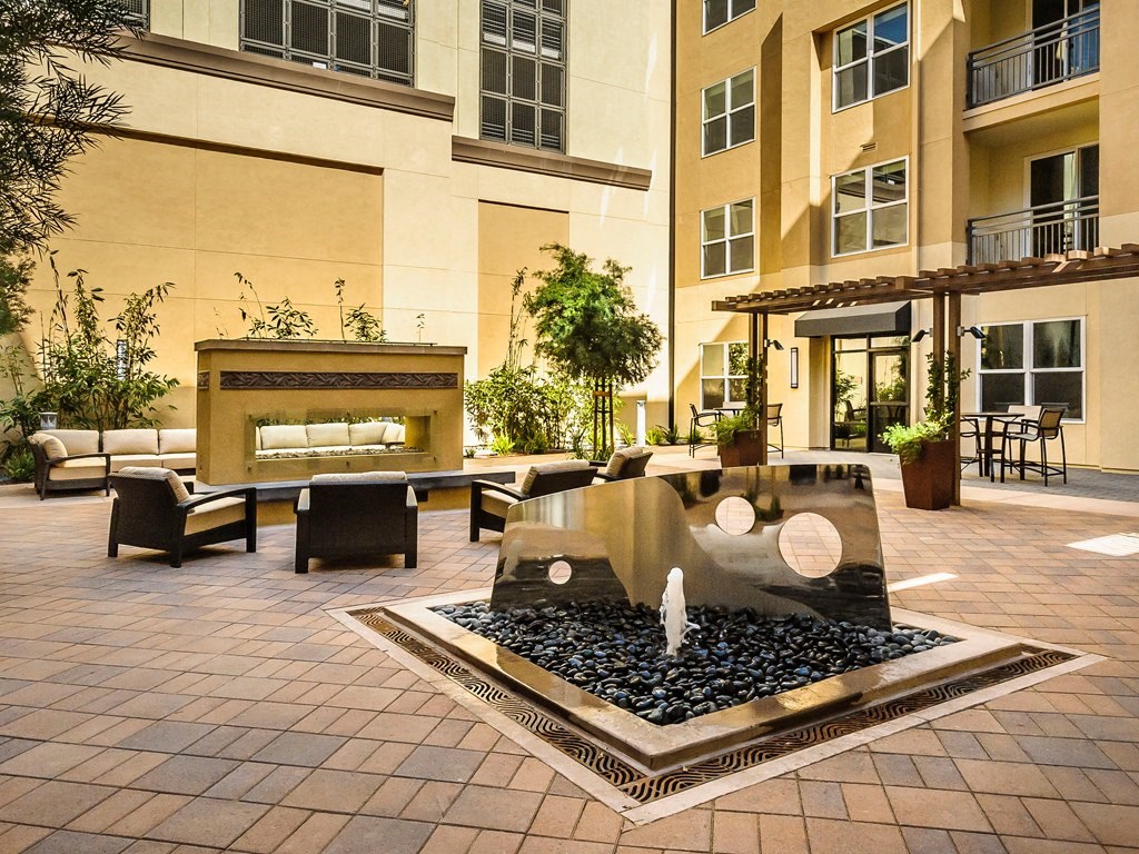 Foster City Apartments for Rent - The Plaza - Outdoor Patio with Comfortable Seating, Fire pit, and Fountain