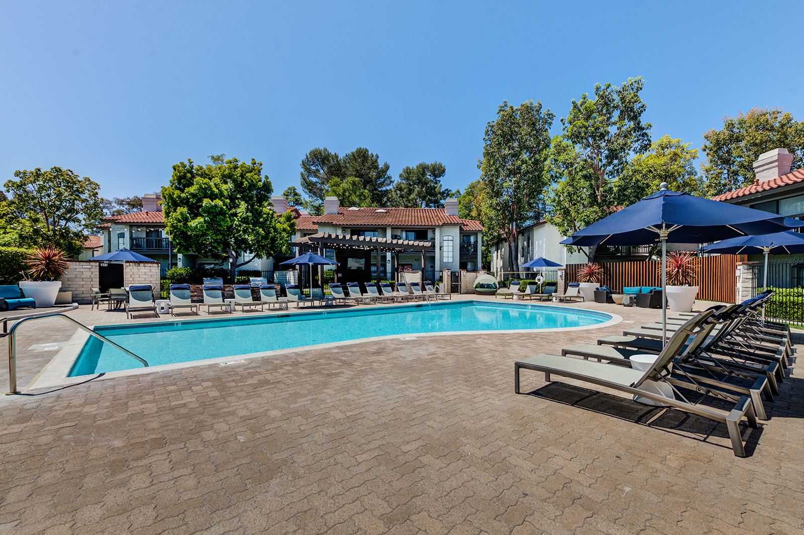 Outdoor pool area with lounge chairs