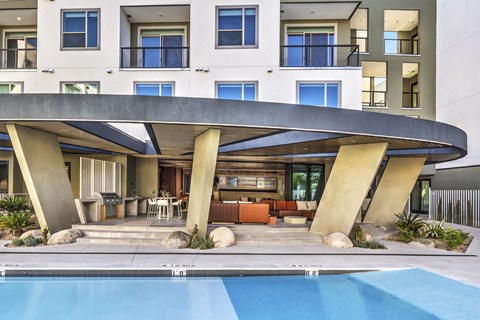 A modern house with a pool in the backyard.