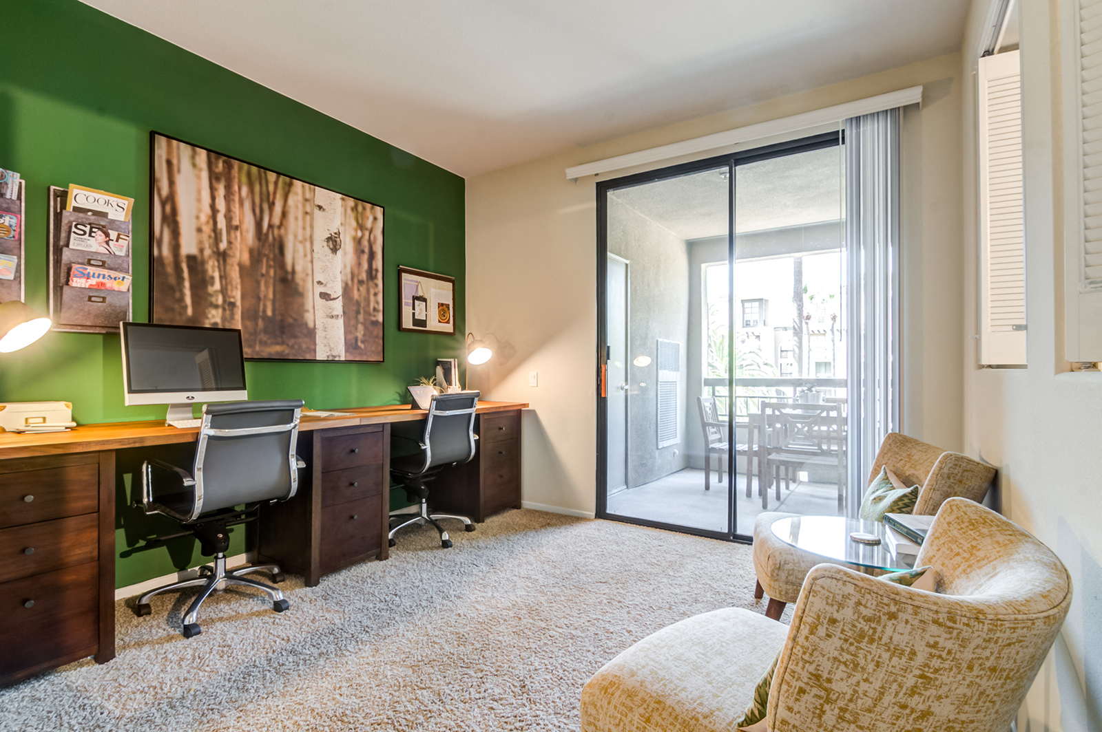 Office area with sliding glass doors to balcony