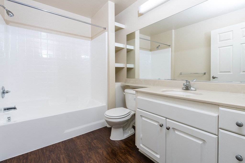 a bathroom with a bathtub toilet and sink
