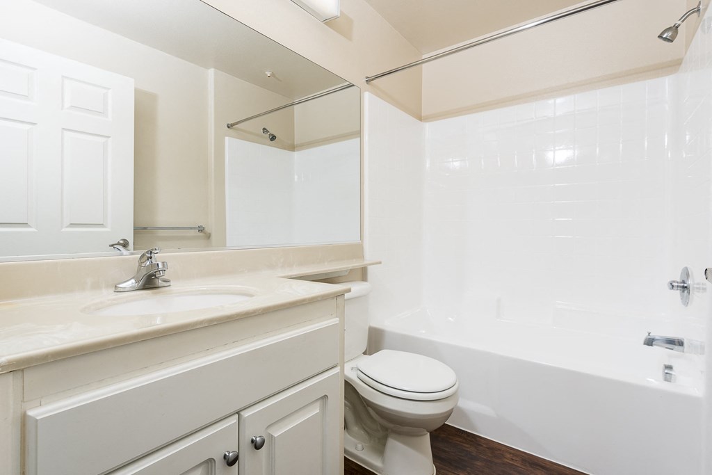 a bathroom with a sink toilet and bathtub