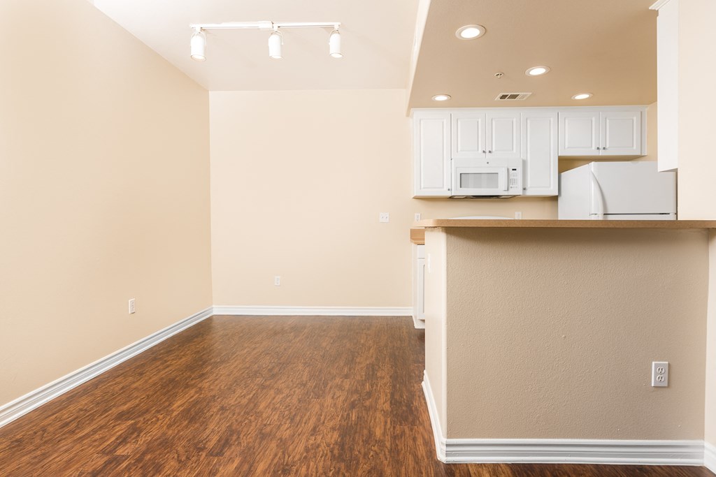 a kitchen and dining area in a 555 waverly unit