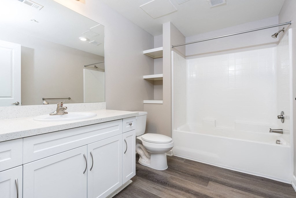 a bathroom with a toilet sink and bathtub