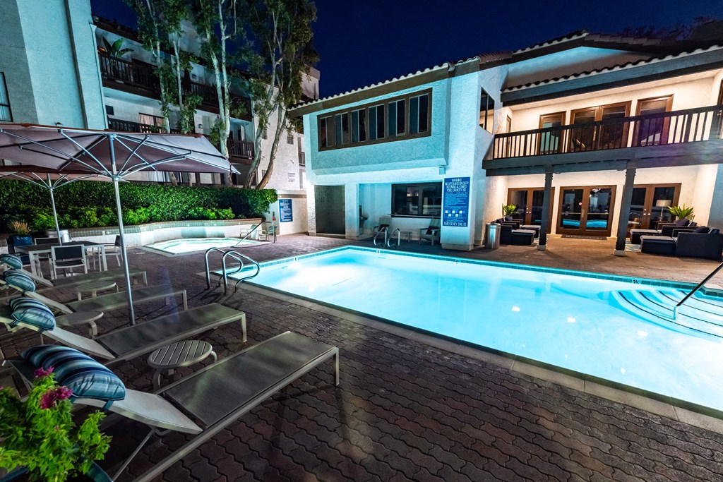 Nighttime pool with lounge seating at Ridgecrest, Lake Forest, California