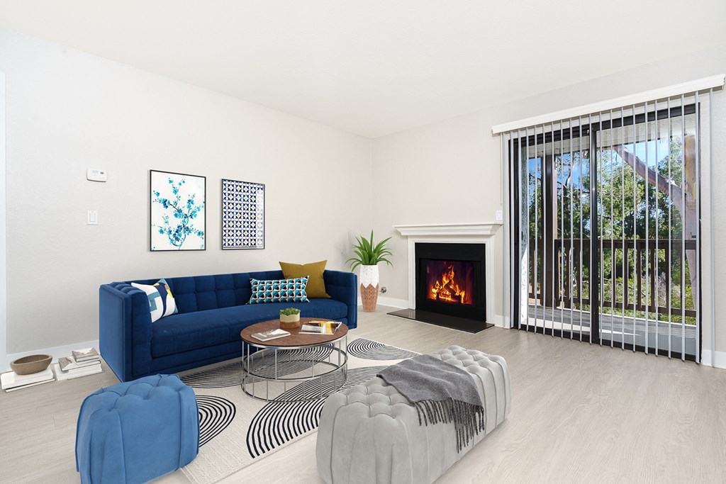 Living room with fireplace and balcony door at Ridgecrest, Lake Forest
