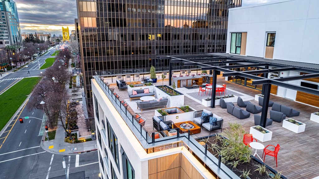 rooftop lounge with seating and street views