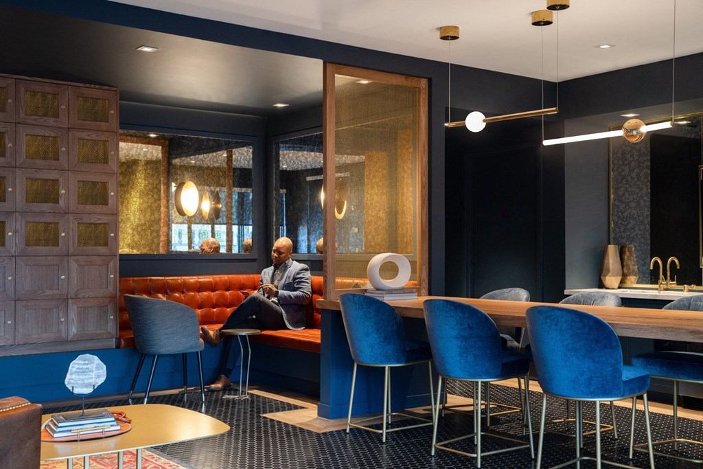 Man sitting in the Skiy Lounge with seating