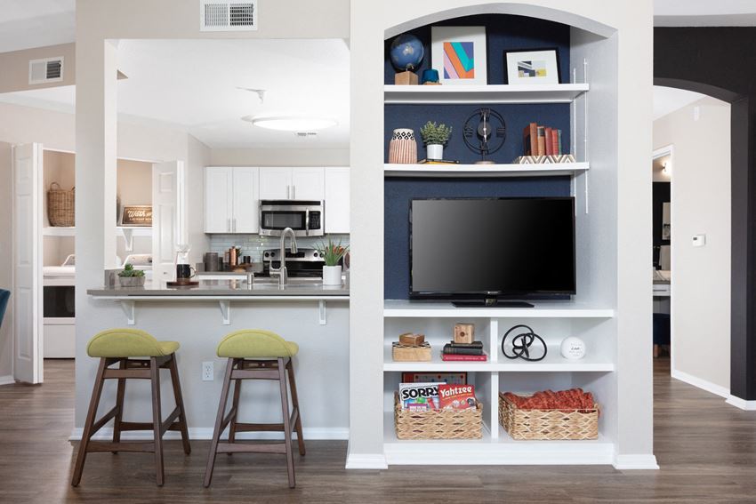 Kitchen with bar seating next to TV - Photo Gallery