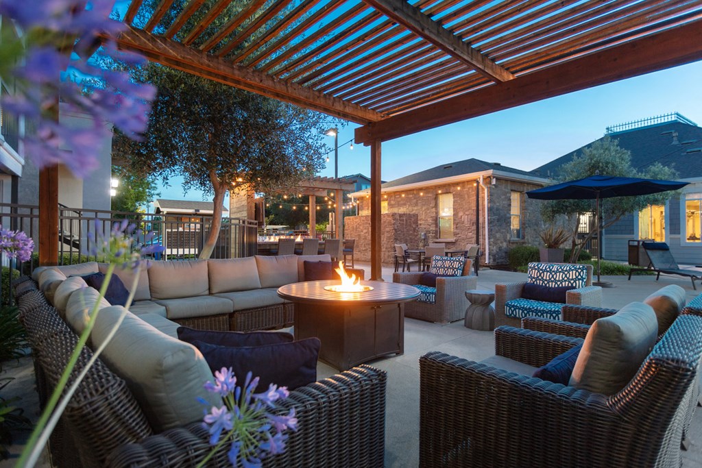 Outdoor seating area with fire pit table