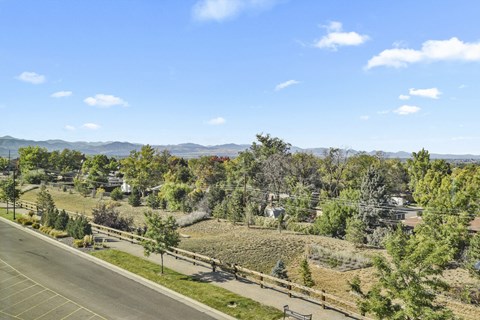 a view of a field with trees and a road at Parkside at Littleton Village, Colorado, 80122