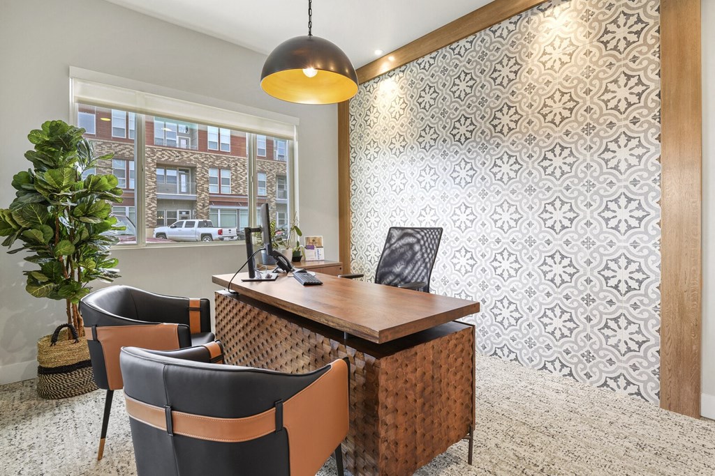 a conference room with a wooden table and chairs and a large window at Parkside at Littleton Village, Littleton, CO