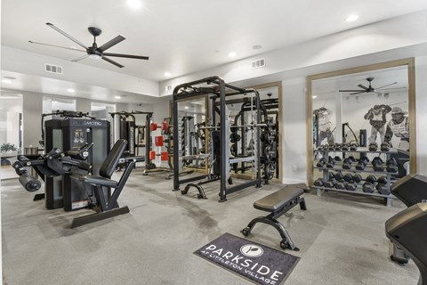 a home gym with weights and cardio machines and a ceiling fan at Parkside at Littleton Village, Colorado