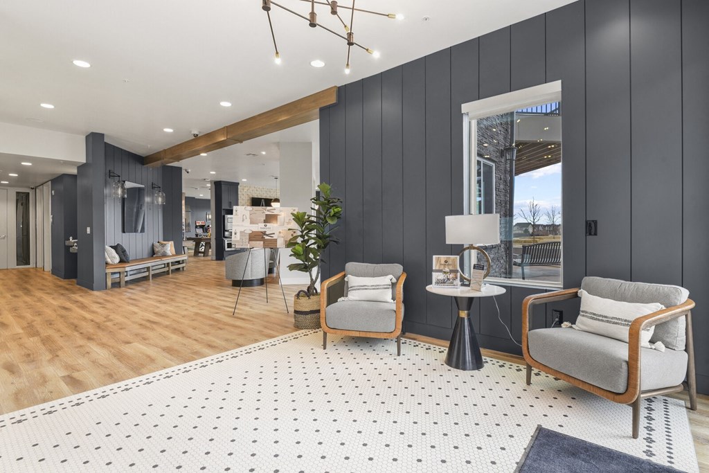 a living room with two chairs and a rug at Parkside at Littleton Village, Littleton, Colorado
