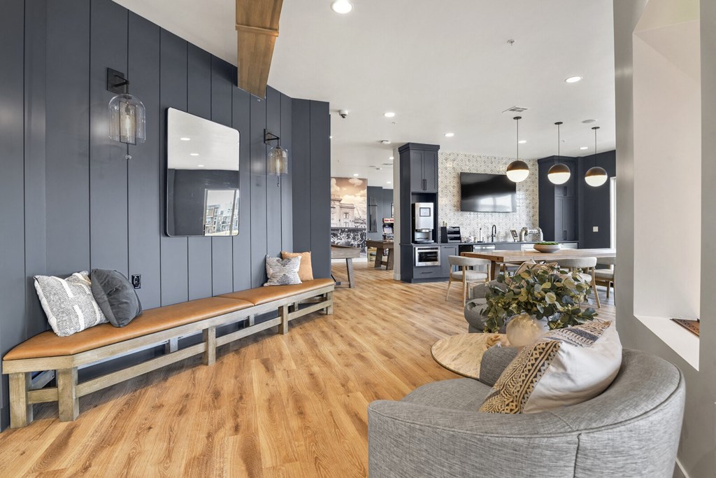 a living room with a couch and a table and a kitchen at Parkside at Littleton Village, Colorado