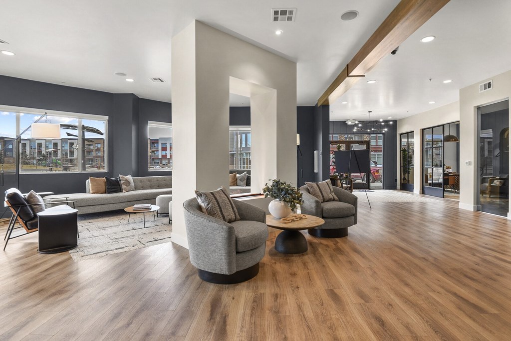a living room with couches and chairs on a wood floor at Parkside at Littleton Village, Littleton, Colorado