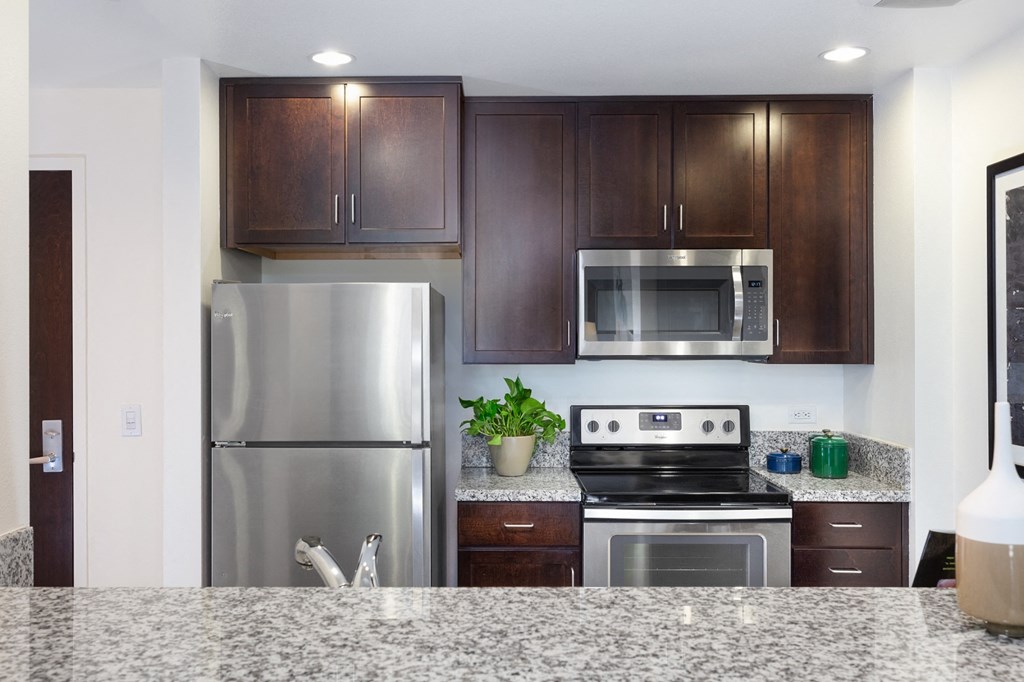 San Fransisco CA Luxury Apartments for Rent - Strata at Mission Bay - Modern Kitchen with Granite-Style Countertops and Wood-Style Cabinets