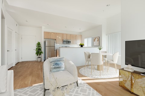 A modern living room with a white sofa and a television.