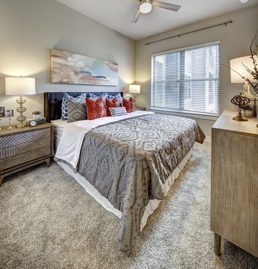 a bedroom with a bed and a window at Arise Riverside, Austin, 78741