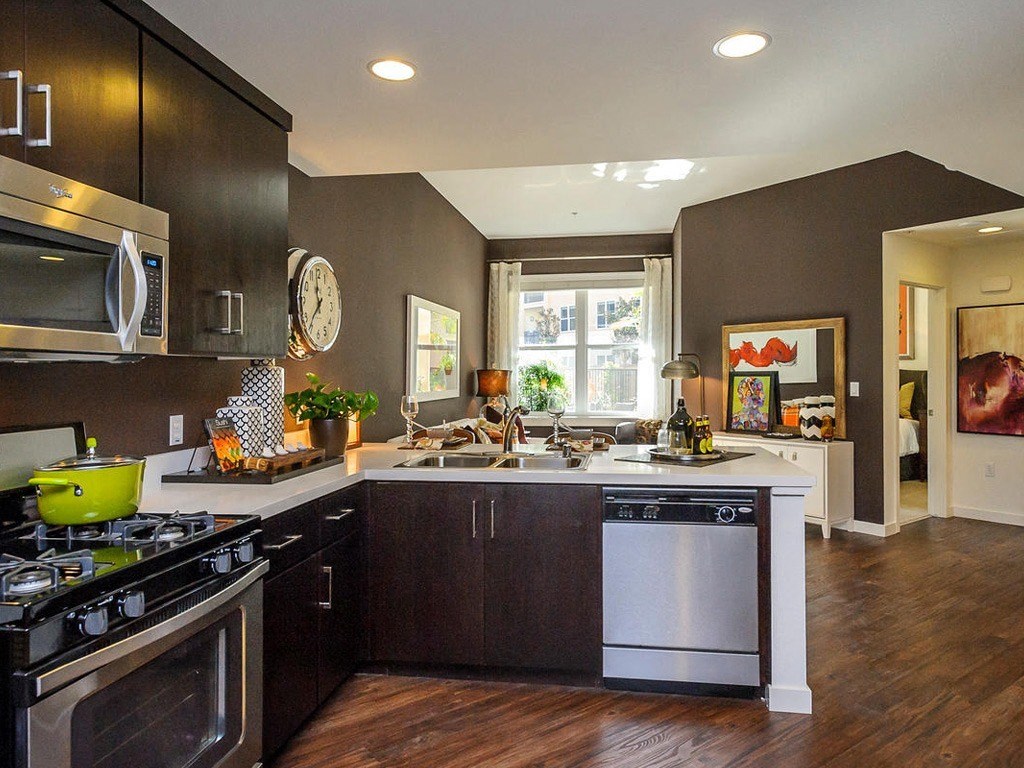 a view of a restaurant with a counter and a window
